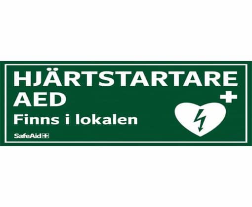 Dekal AED finns i lokalen 15×7,5 cm